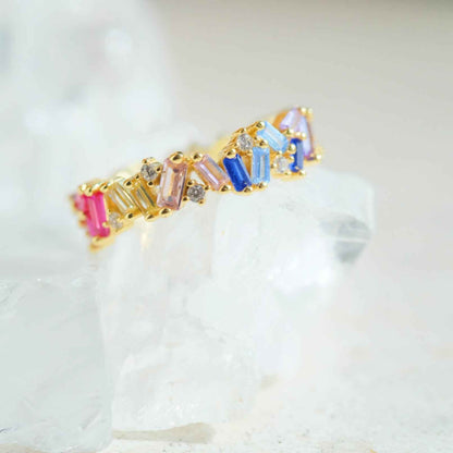 Side view of STAR WISH rainbow zircon band ring with gold plated finish