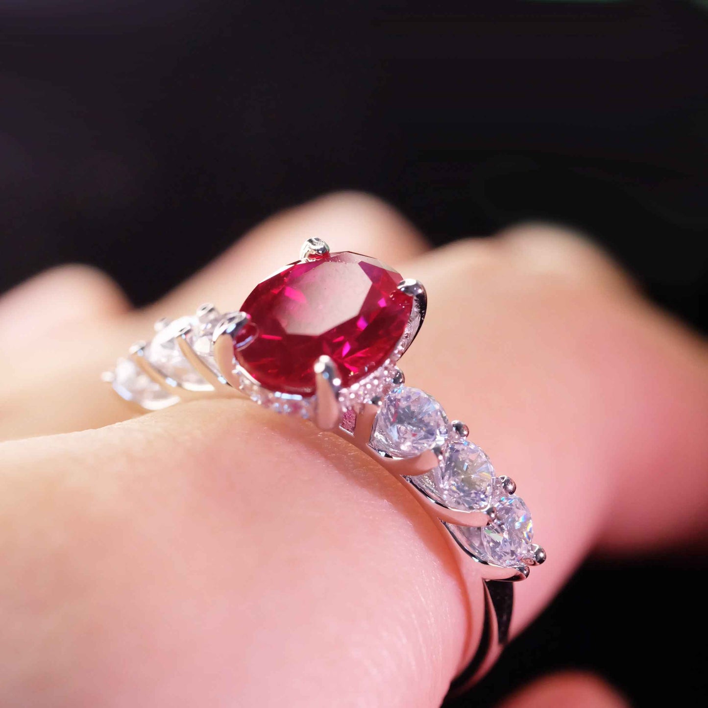 Detail view of STAR WISH red zircon ring with sterling silver setting