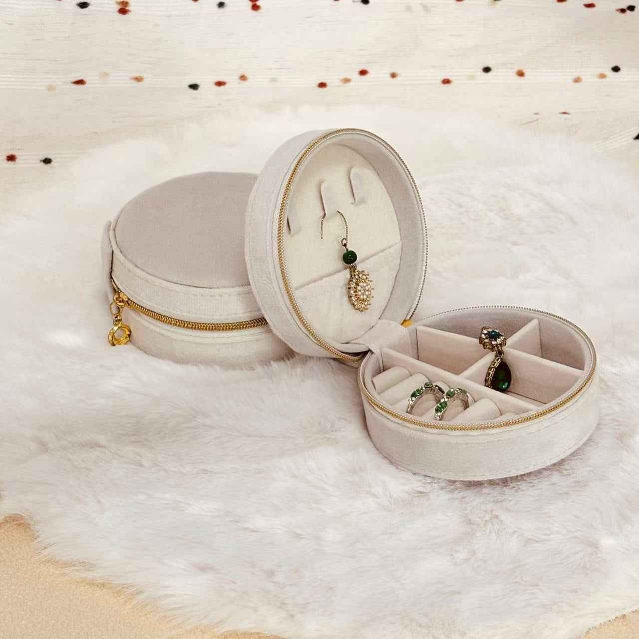 Interior compartments of round velvet travel jewelry organizer