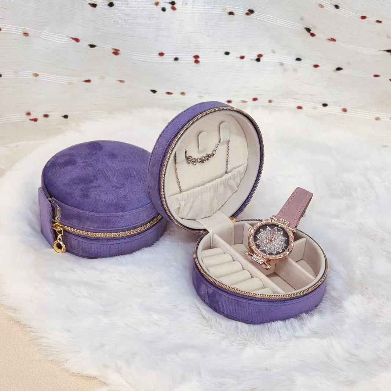 Open detail of round velvet jewelry organizer compartments