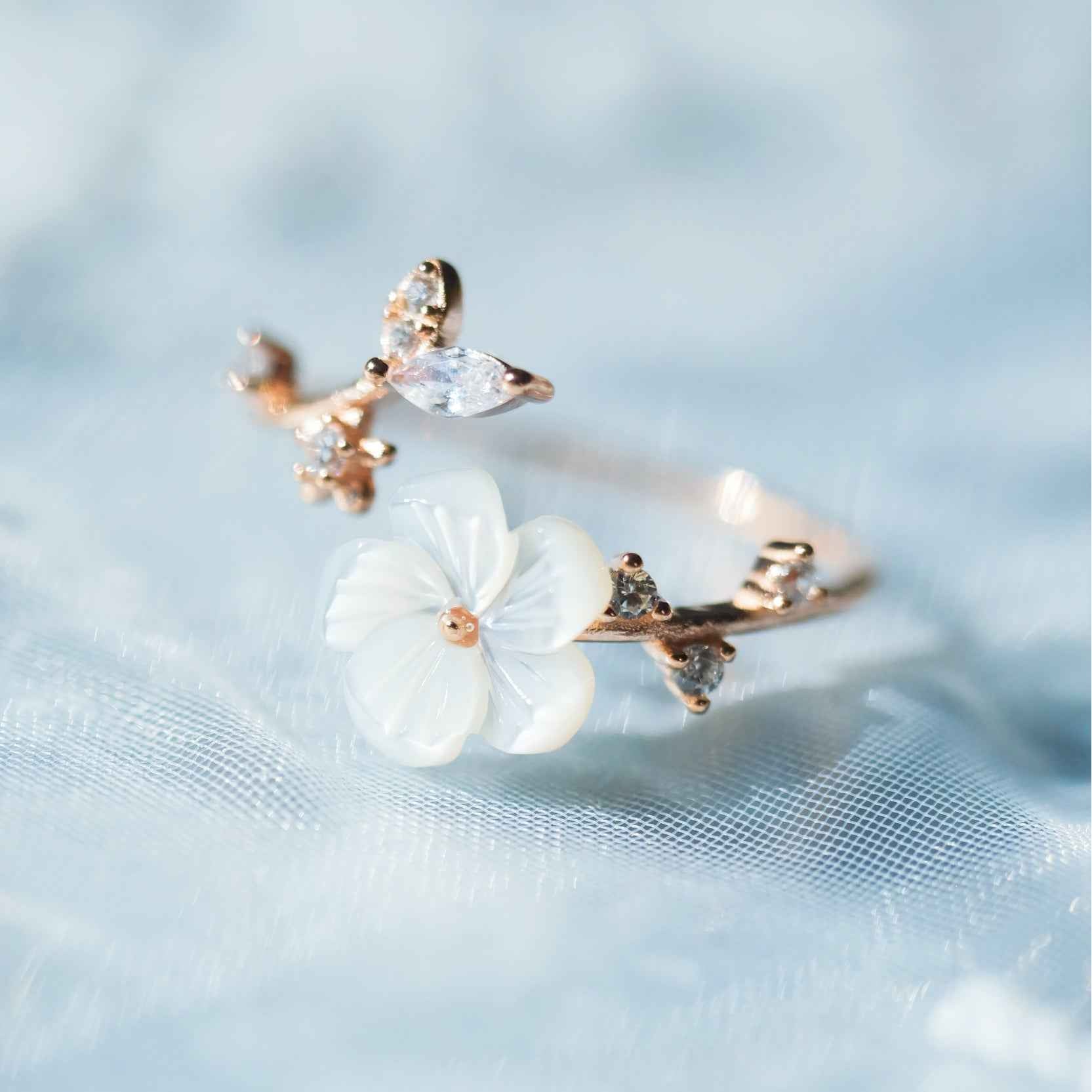 STAR WISH shell flower sterling silver ring shown on hand