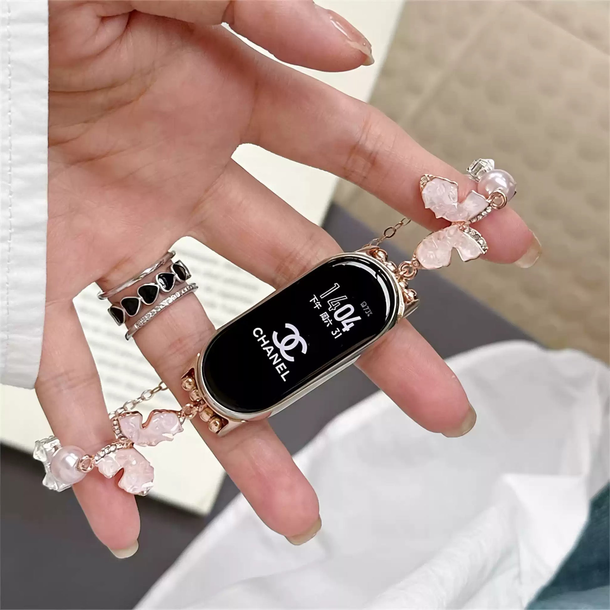 Pink crystal bow Apple Watch band in hand