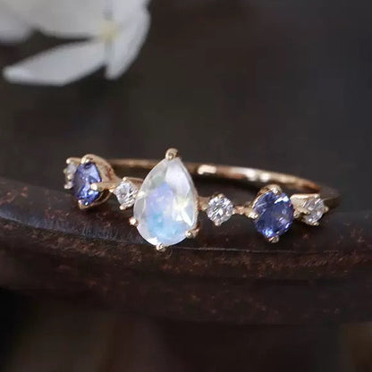 STAR WISH teardrop blue gemstone ring front view with silver band