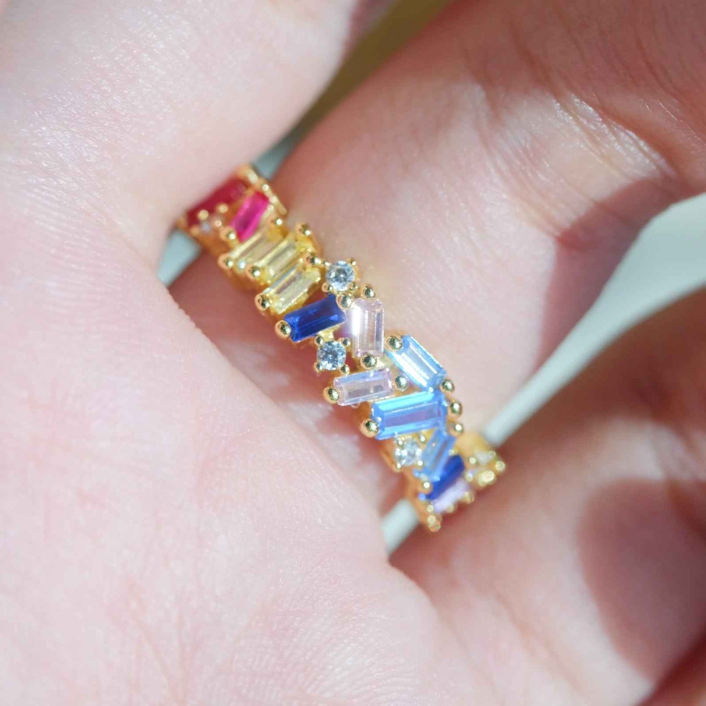 Detail view of STAR WISH rainbow zircon band ring setting