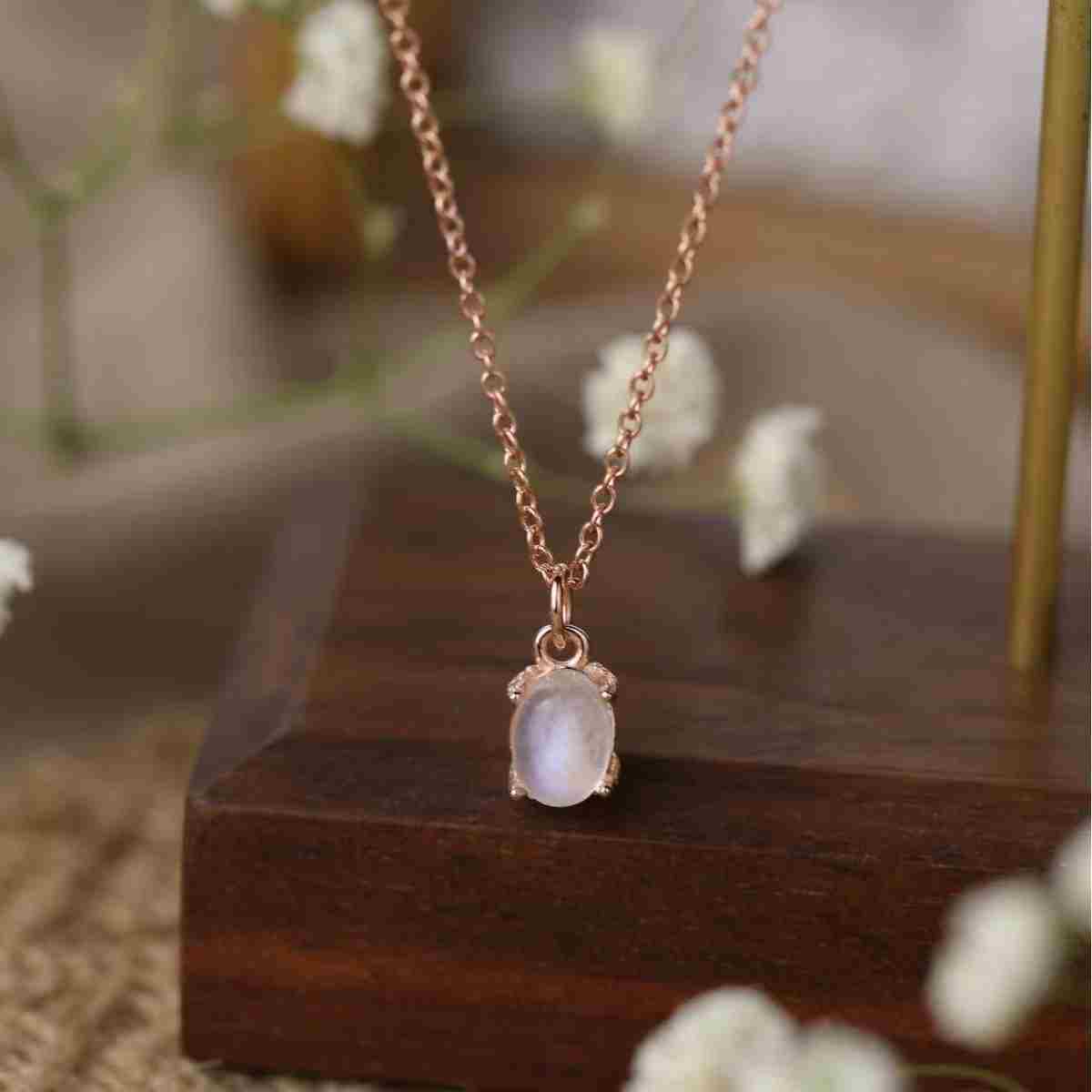 Oval moonstone necklace with 925 sterling silver and 18K rose gold plating, featuring a smooth moonstone pendant.